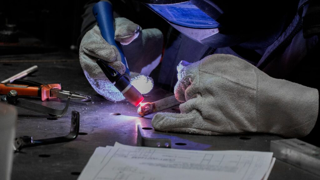 A man working on a piece of metal